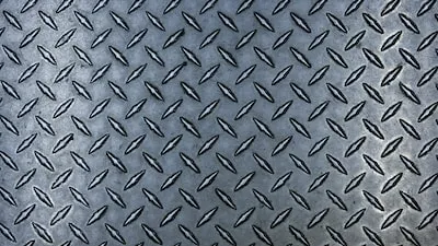 a close up of a metal diamond plate